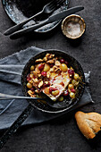 Baked feta cheese with grapes and walnuts