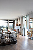 Glass console table decorated for Christmas in elegant living room