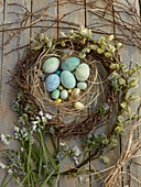 Easter wreath with flowering willow catkins and wild garlic
