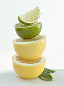 Grapefruit and lime halves stacked one on top of each other