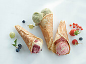 Homemade ice cream cones with different kinds of fruity ice cream
