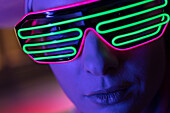 Woman in modern neon glasses
