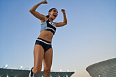 Excited track and field athlete celebrating victory