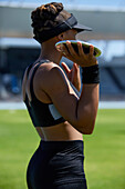 Female track and field athlete preparing to throw discus