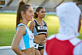 Female track and field athletes preparing for competition