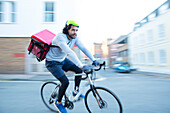 Bike messenger delivering food on bicycle