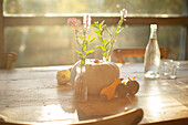 Wildflower bouquets, pumpkins and gourds on table