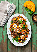 Pumpkin and lentil salad with goat cheese and walnuts