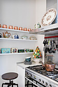 Gas cooker and dish rack in white kitchen