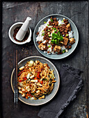 Fried vegetarian meat with Sichuan pepper, leek, tofu and nudels with tofu and vegetables