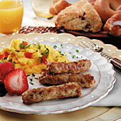 Turkey Sausage, scrambled eggs and fresh fruit, breakfast pastries and orange juice