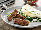 Skinless turkey breakfast sausage with an egg white spinach and feta cheese omelette