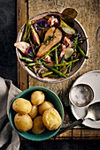 Stew with beans, pears and bacon, served with jacket potatoes