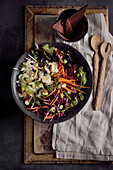 Red cabbage and fennel salad with carrots, beetroot leaves, feta cheese and basil-cashew pesto