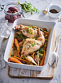 Baked rabbit legs with vegetables