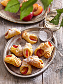 Curd pastries with red plums