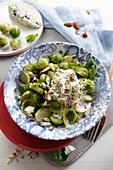 Braised brussels sprouts with cheese sauce and almonds