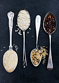 Various types of rice on spoons