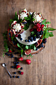 Fig tart with fresh figs, cream and berries