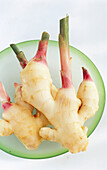 Fresh ginger root on a plate