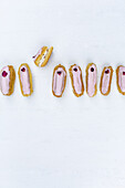 Eclairs with a pink glaze