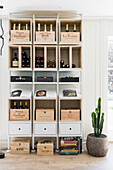 Wine rack with wooden boxes and cookery books