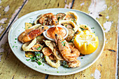 Sicilian fried fish and seafood with lemon wedges