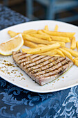 Sicilian grilled swordfish with lemon and chips