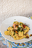 Sicilian paccheri pasta with a mix of seafood