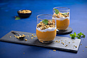 Pumpkin pudding with whipped soy cream and pumpkin seed crumble (vegan)