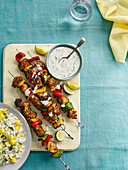 Jerk chicken skewers with dip and mango rice