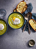 Cream of asparagus soup with poached egg and toasted bread