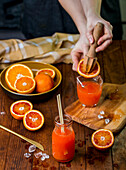 Fresh orange juice with citrus Reamer