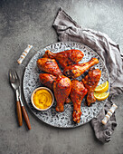 Tandoori chicken legs served with exotic yellow sauce and lemon wedges