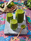 Green smoothie with spinach, ginger, lime, tumeric and lemongrass