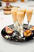Passion fruit drink in champagne glasses