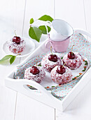 Donuts with cherries and coconut flakes
