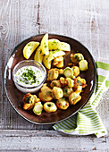 Fried Brussels sprouts served with boiled potatoes and herb quark