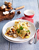 Pancakes with mushroom and turkey meat filling