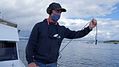 Researcher capturing sounds of dolphins