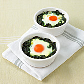 Baked eggs in spinach pots
