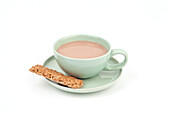 Cup of milky tea with oat biscuit