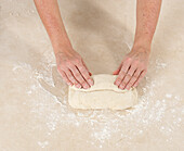 Shaping baguette dough using hands