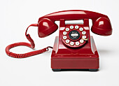 Red telephone with rotary dial