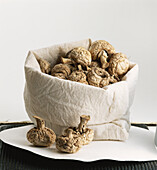 Cloth bag containing dried mushrooms