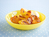 Grilled peaches in a bowl