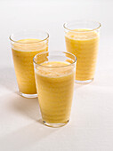 Three glasses of Mango and Lime smoothies