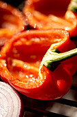 Red peppers on barbeque grill