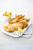 Battered fish and chips with tartar sauce