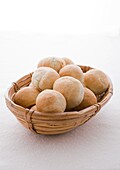 Basket of fresh white bread rolls